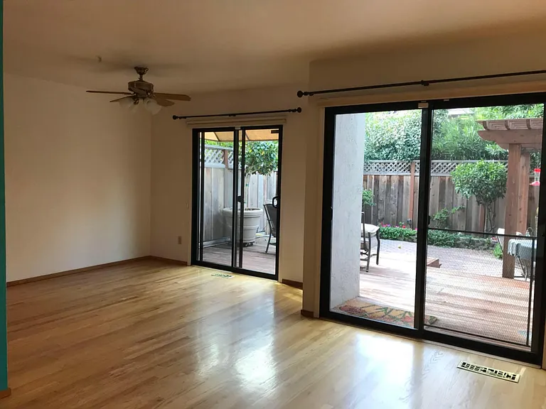 First floor living room and backyard (with deck)