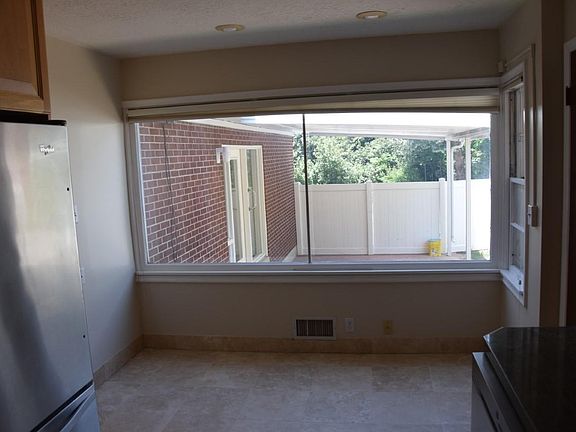 Kitchen overlooks covered patio & gets plenty of natural light