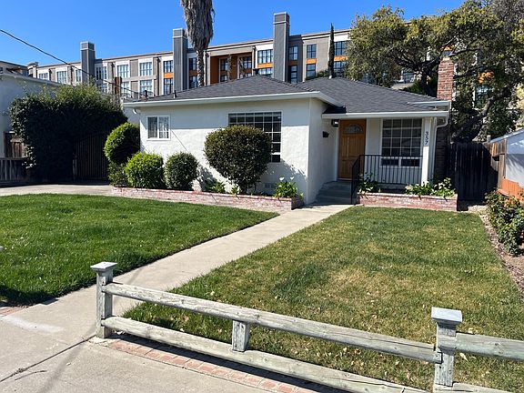 Bright and airy 1,340 square foot house featuring a welcoming front porch facing a green lawn. Brand new composite roofing has been installed on the house and the garage.