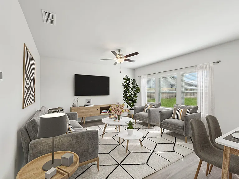 Living room with large window letting in a ton of natural light.