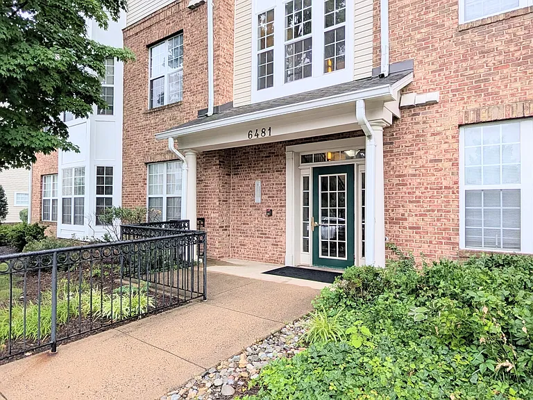 Secure front door with buzzer in well maintained unit.