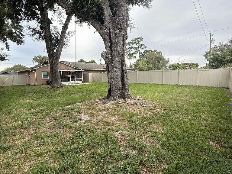 Large privately fenced backyard.