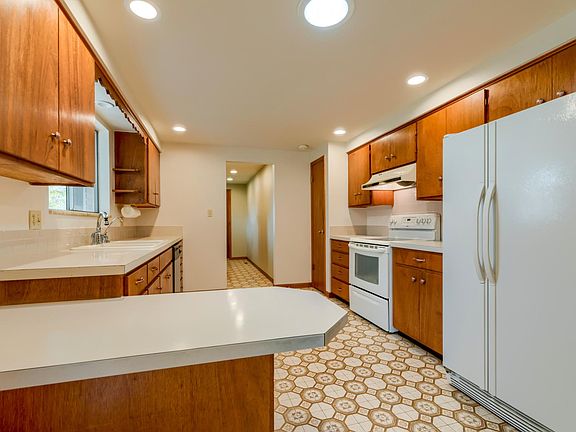 Functional kitchen with pantry and tons of cabinetry leads t