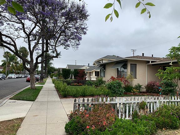 Front of the home there is a beautiful tree providing shade in the afternoon.