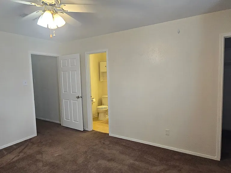Bedroom overlooks carport. Large walking closet, ensuite bathroom