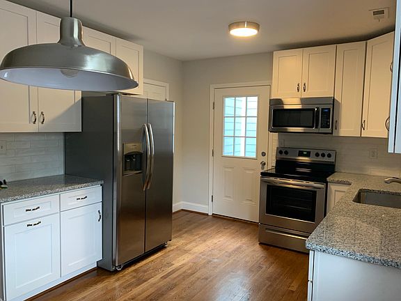 Large kitchen with separate pantry space leading to outdoor private patio