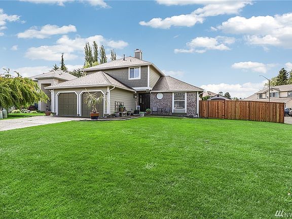 Perfectly appointed on a corner lot within a quiet cul-de-sac.