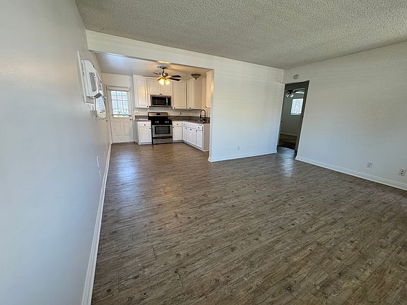 Living Room into Dining Room and Kitchen