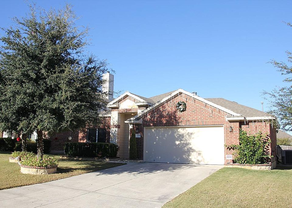 Front of house and 2.5 car garage