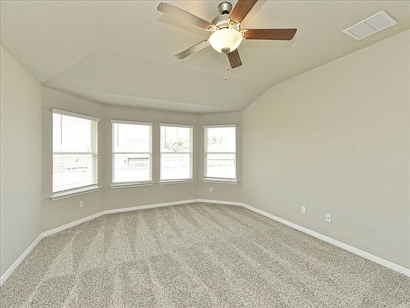 Get plenty of natural lighting in the primary bedroom.