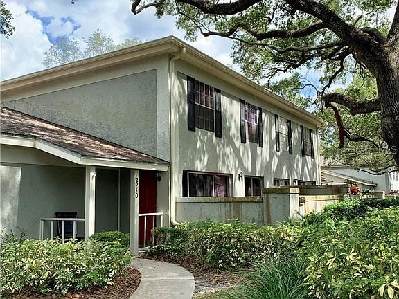 Two-story townhome. Lots of oak trees in the community.