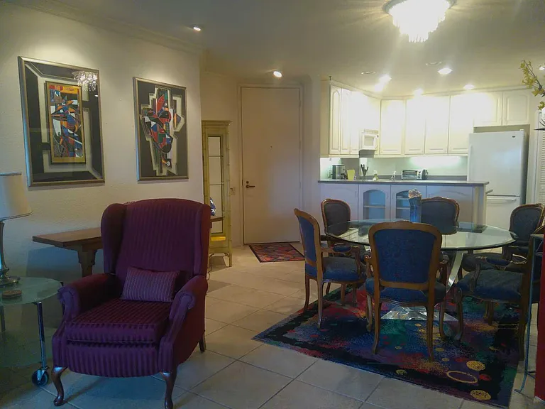 VIEW FROM FROM LIVING ROOM OF ENTRY INTO DINING AREA AND KITCHEN