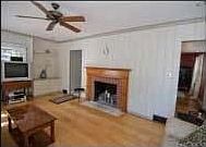 Living Room with wide plank hardwood flooring and fireplace
