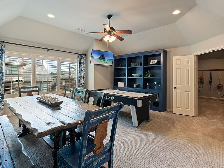 Backyard oasis with a sparkling heated pool and spa surrounded by professional landscaping