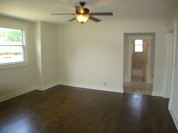 Living room offers beautiful hardwoods and lots of light.