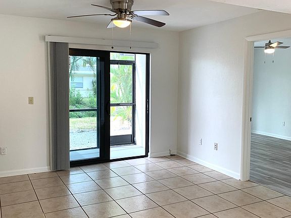Dining/Livingroom that goes to enclosed screened in Lanai.