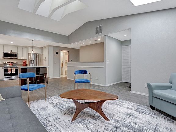 New flooring, fresh paint, and high ceilings = comfortable living space!