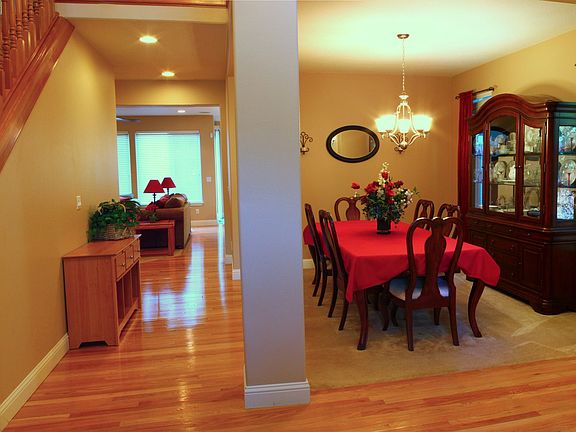 Entry looking at dining and down hall to kitchen/family