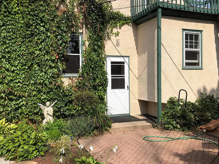 Recent photo of back patio facing back of house