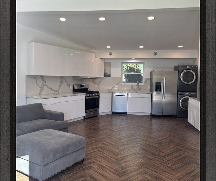 The open concept living room and kitchen - everything brand new