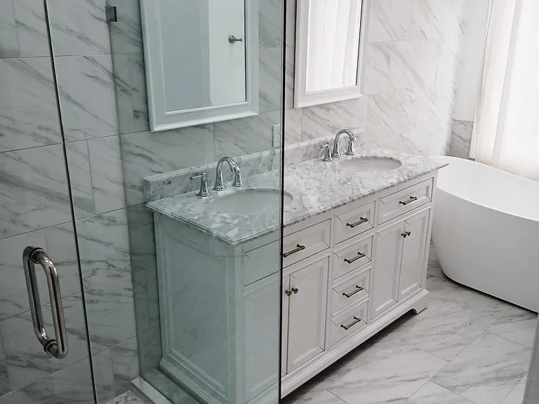 Carrara marble style flooring, Carrara marble counter tops , free standing bathtub . Dare to compare this bathroom with any other existing rental !