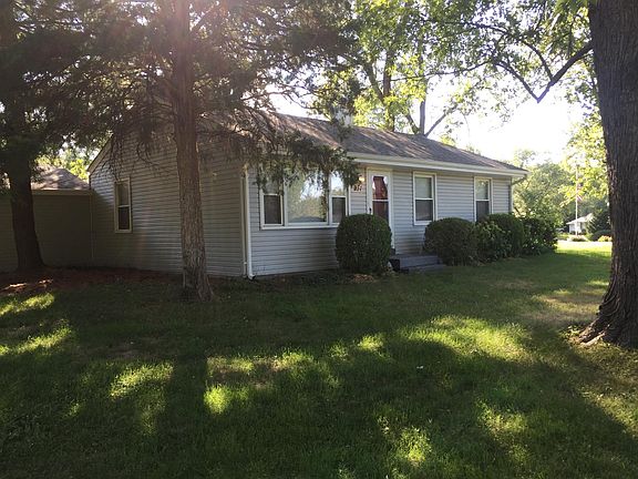Front of house with attached two car garage.