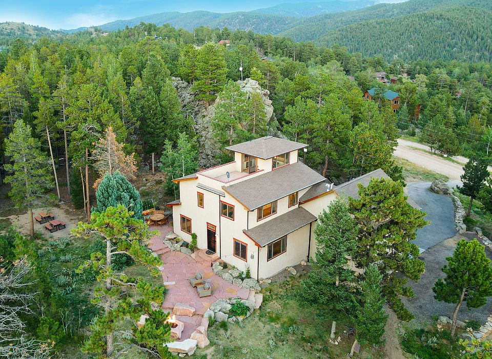 Crow's nest and rooftop patio, backyard stone patio & gas fire pit, paved driveway, forested acreage