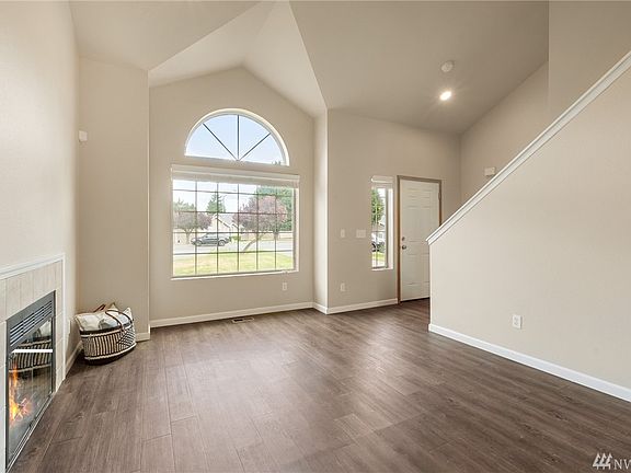 The entry foyers opens into this spacious and airy living room. 
