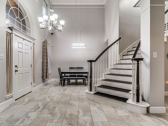 Open plan dining room and wood finished stairs