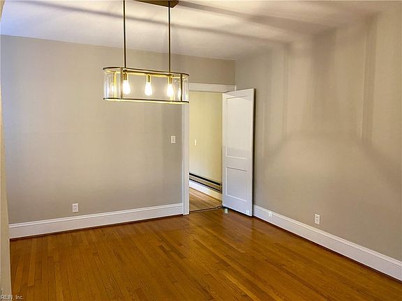 Dining Room opens to Living Room and attaches to Kitchen