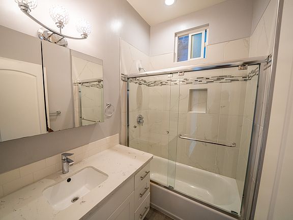Modern bathroom with German fixtures and auto temp. sensing shower, ventilation fan, window and much more.