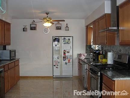 Roomy living area shows new hardwood floors throughout.