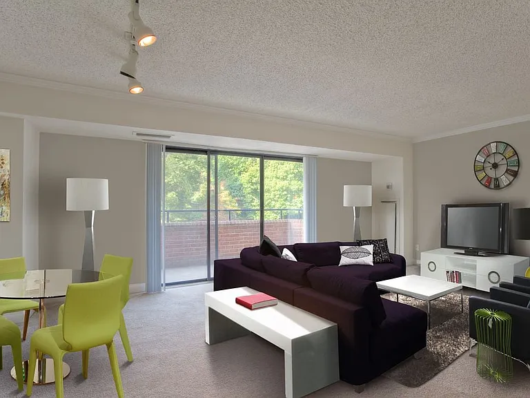 Living and dining areas with balcony access and carpeted flooring