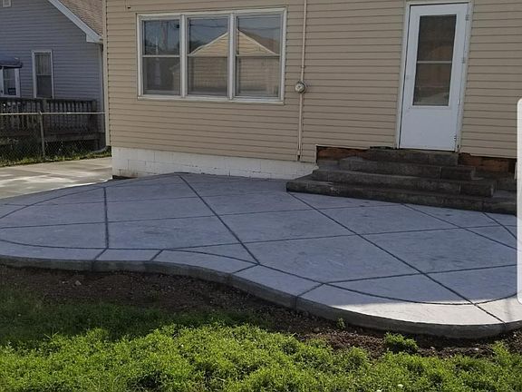 New stained concrete patio. Sunroom with new picture window not shown.