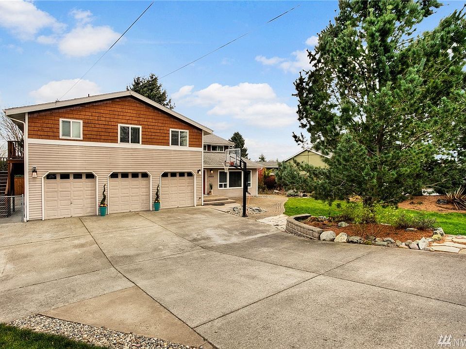 Situated on a lovely street of high quality homes, this incredibly spacious residence has all the room you could desire. Extra long driveway provides ample guest parking. Staircase to the left of the home provides direct access to the apartment space. 