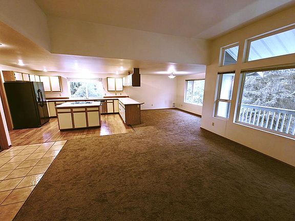 From the main hall way looking toward the kitchen, dining area and living room.