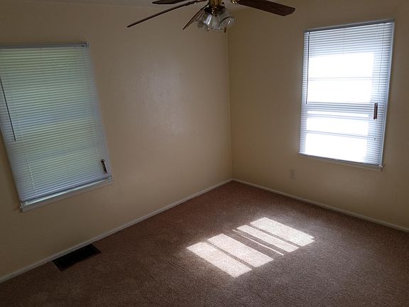 Each bedroom features new carpet, ceiling fans, and closets