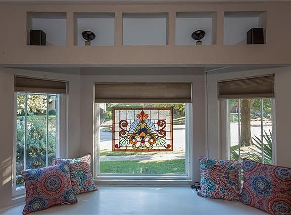 Deep bay windows with a cozy seat and southern exposure.