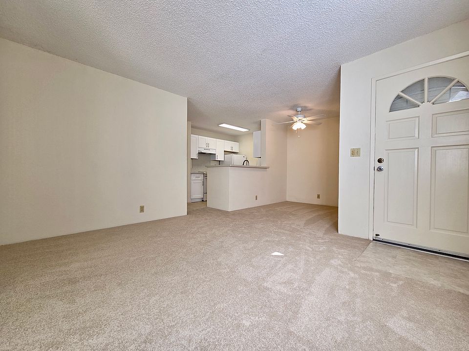 Living Room with Window AC and New Carpet