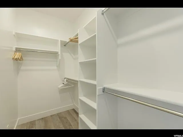 Large walk-in closet in master bedroom.