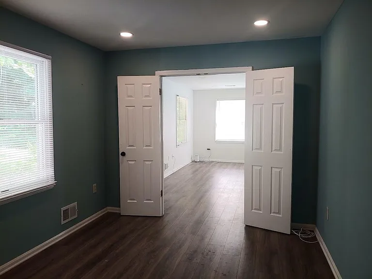 Second bedroom/den and living room.