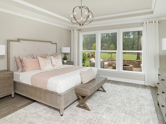 Elegant owner s suite with tray ceiling. Bright and spacious with room to relax - Model Representa