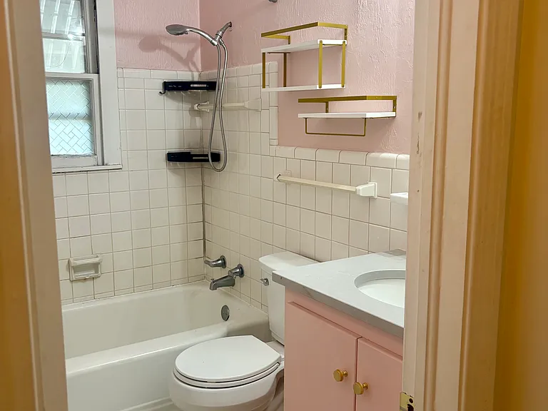 Vintage bathroom with new vanity, quartz countertop and fixtures.