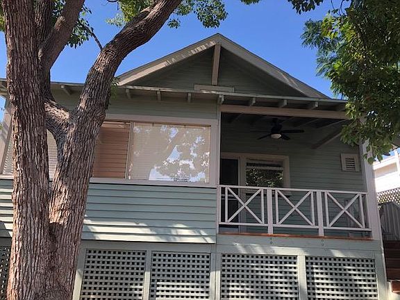 Covered porch overlooking canyon yard with ceiling fan. Can fit a small outdoor table