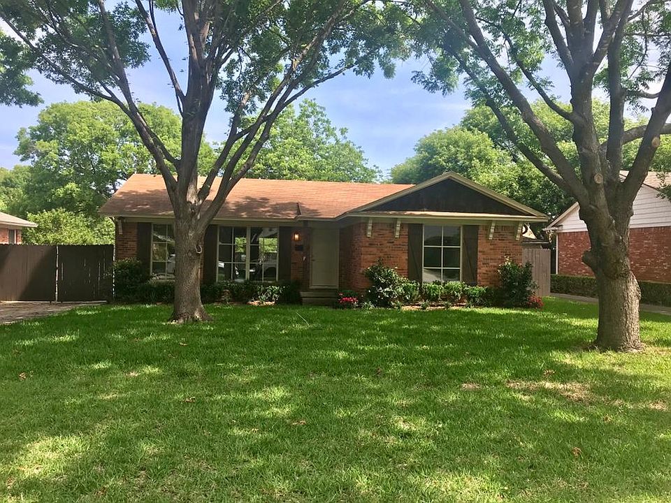 Brand new landscaping and huge trees.