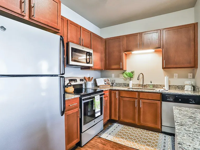 Residences at The Streets of St. Charles Apartment Homes — Photo 1