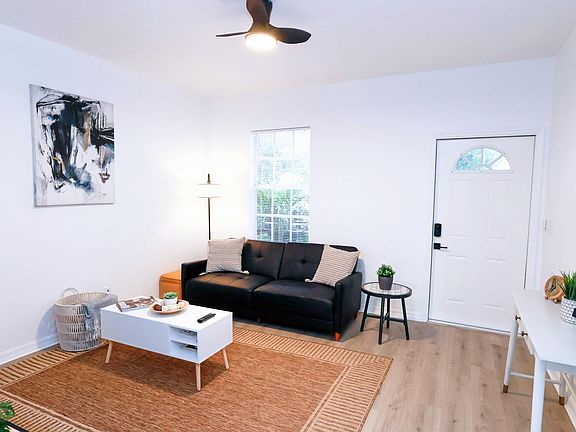 Spacious living room with a sofa/sleeper.