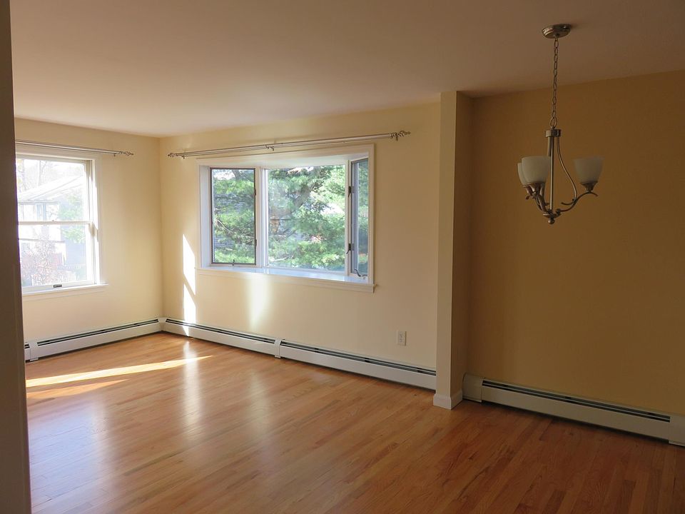 Dining room and living room with newly refinished hardwood floors