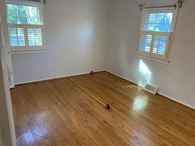 This is the main bedroom, 2 closets. Tape measures show where a king size bed would fit.
