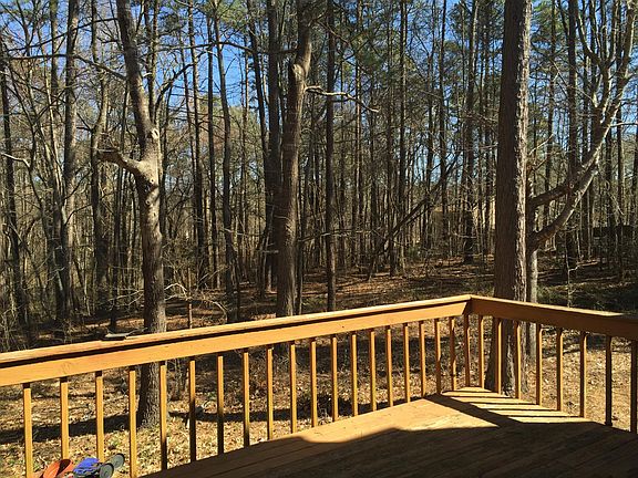 large deck back with beautiful view to natural woods